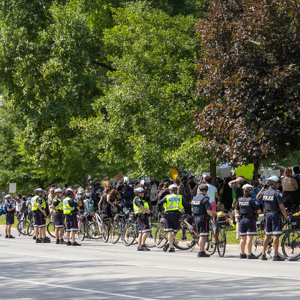 Ontario police in line up on road with bikes